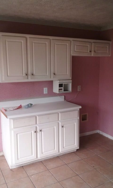 Before: outdated cabinetry and laminate counters